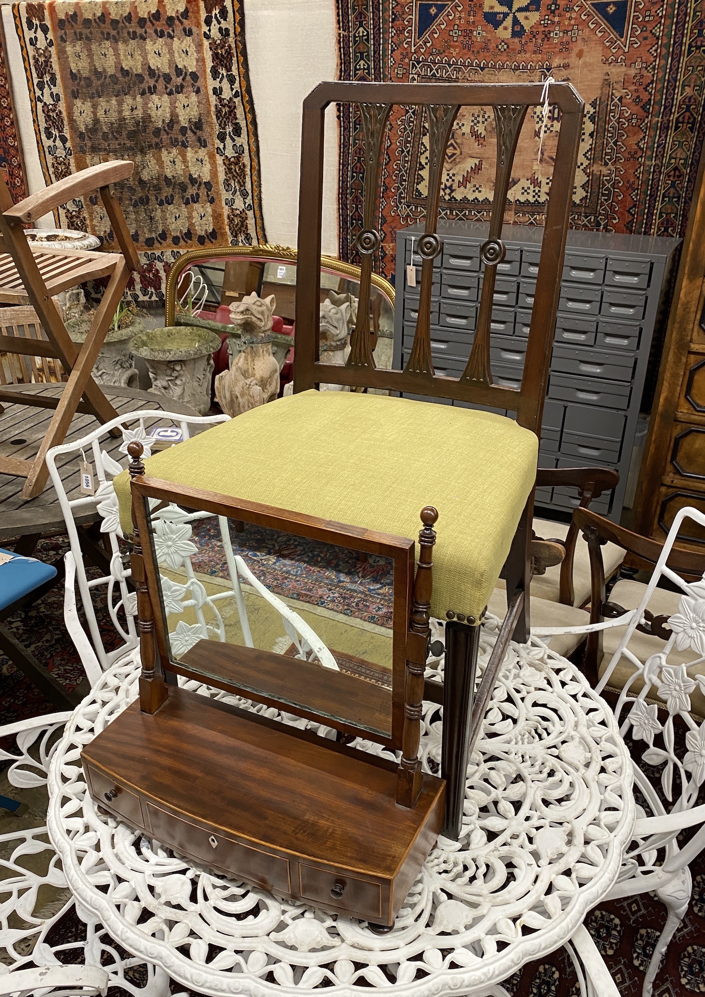 A Regency mahogany bow front toilet mirror and a George III dining chair